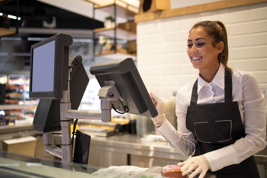 fishmonger weighing on supermarket scales